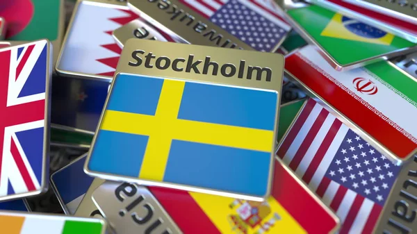 Imán de recuerdo o insignia con texto de Estocolmo y bandera nacional entre diferentes. Viajar a Suecia renderizado 3D conceptual —  Fotos de Stock