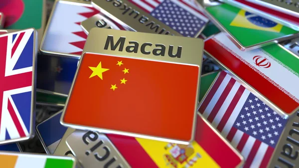 Magnet na suvenýry nebo odznak s textem Macau a národní vlajkou mezi různými. Cestování do Číny konceptuální prostorové vykreslování — Stock fotografie