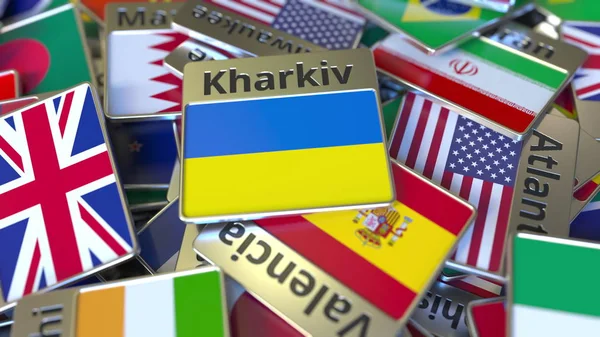 Aimant souvenir ou badge avec texte Kharkiv et drapeau national parmi les différents. Voyager en Ukraine rendu 3D conceptuel — Photo