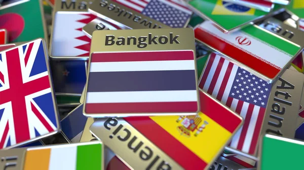 Souvenir magneet of badge met Bangkok tekst en nationale vlag onder verschillende. Reizen naar Thailand conceptuele 3D-rendering — Stockfoto