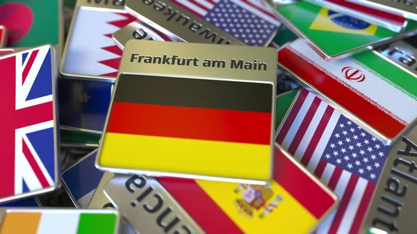 Souvenir magneet of badge met Frankfurt am hoofdtekst en nationale vlag onder verschillende. Reizen naar Duitsland conceptuele 3D-rendering — Stockfoto