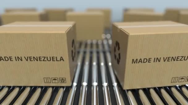 Boxes with MADE IN VENEZUELA text on roller conveyor. Venezuelan goods related loopable 3D animation — Stock Video