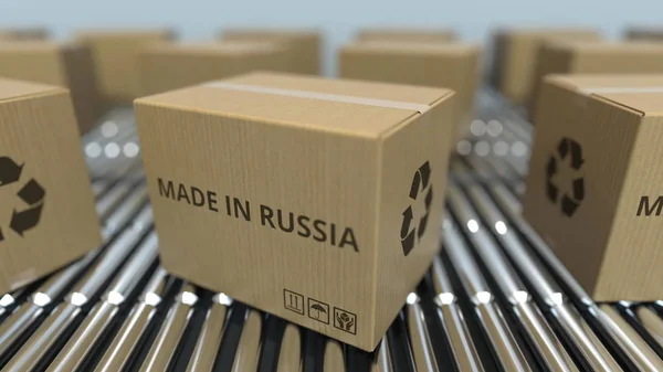 Cajas con texto MADE IN RUSSIA sobre transportador de rodillos. Productos rusos relacionados con la representación 3D —  Fotos de Stock
