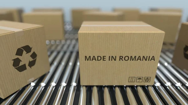 Cajas con texto MADE IN ROMANIA sobre transportador de rodillos. Productos rumanos relacionados con la representación 3D —  Fotos de Stock