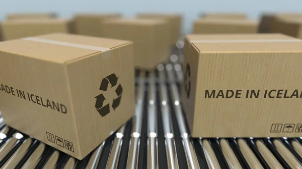 Cartones con texto MADE IN ISELAND en transportador de rodillos. Productos islandeses relacionados con la representación 3D —  Fotos de Stock