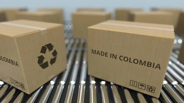 Caixas com texto MADE IN COLOMBIA em transportador de rolos. Produtos colombianos relacionados 3D renderização — Fotografia de Stock
