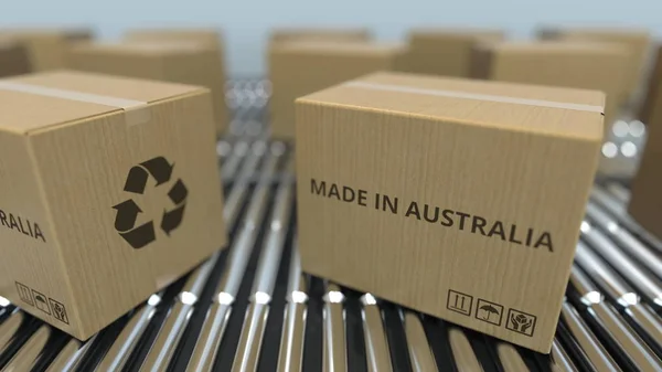 Cartones con texto MADE IN AUSTRALIA sobre transportador de rodillos. Productos australianos relacionados 3D rendering —  Fotos de Stock