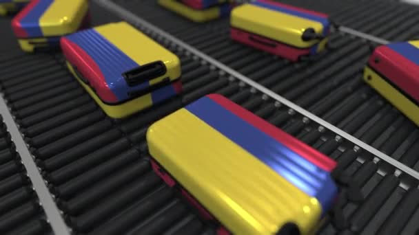 コロンビアの旗をフィーチャーした多くの旅行スーツケース。コロンビアの観光概念アニメーション — ストック動画