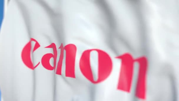 Bandiera sventolante con logo Canon Inc. primo piano. Animazione 3D loop editoriale — Video Stock