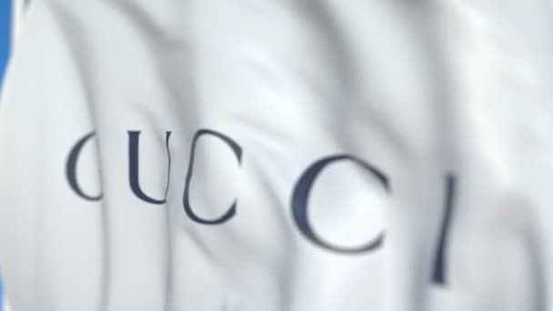 Bandiera sventolante con logo Gucci, primo piano. Animazione 3D loop editoriale — Video Stock