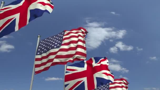 Waving flags of Britain and the USA on sky background, loopable 3D animation — Stock Video