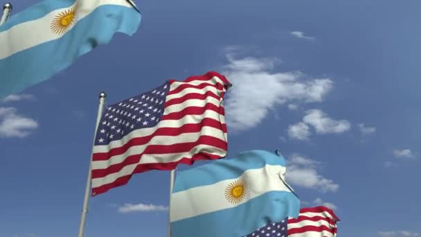 Row of waving flags of Argentina and the USA, loopable 3D animation — Stock Video