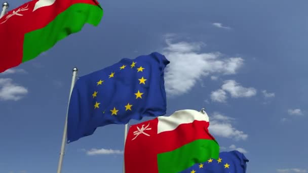 Vlajky Ománu a Evropské unie na mezinárodní schůzce, smyklihodné 3D animace — Stock video