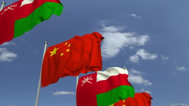 Прапори Оман і Китай на міжнародній нараді, що не відповідає 3D-анімації — стокове відео