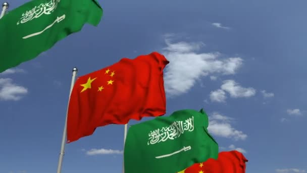 Flags of Saudi Arabia and China at international meeting, loopable 3D animation — Stock Video