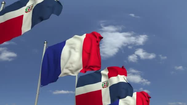 Vlaggen van de Dominicaanse Republiek en Frankrijk op internationale vergadering, loop bare 3D-animatie — Stockvideo