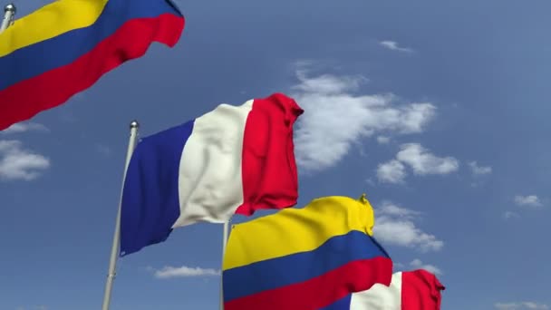 Bandeiras da Colômbia e da França contra o céu azul, animação 3D loopable — Vídeo de Stock