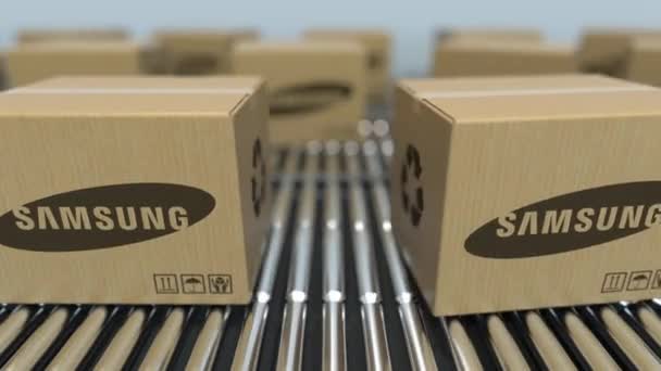 Las cajas de cartón con el logotipo de SAMSUNG se mueven en el transportador de rodillos. Animación en 3D loopable editorial — Vídeos de Stock