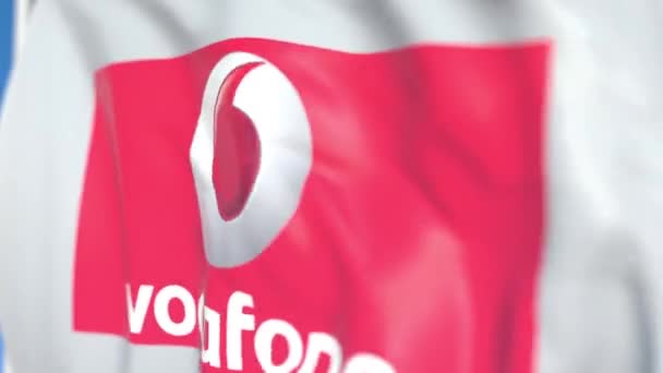 Vodafone plc logolu bayrak sallamak, yakın çekim. Editoryal döngülü 3d animasyon — Stok video