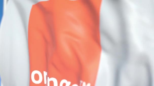 오렌지 S.A. 로고와 깃발을 흔들며, 클로즈업. 에디토리얼 루프 가능 3D 애니메이션 — 비디오