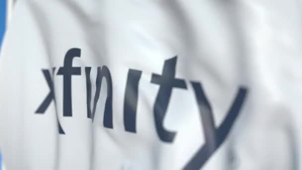 Xfinity 로고가 있는 깃발을 흔들며 클로즈업. 에디토리얼 루프 가능 3D 애니메이션 — 비디오