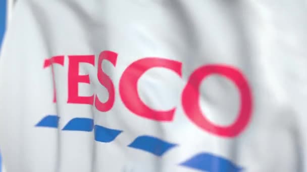 Tesco PLC logosu, yakın çekim ile bayrak sallıyor. Editoryal loopable 3D animasyon — Stok video