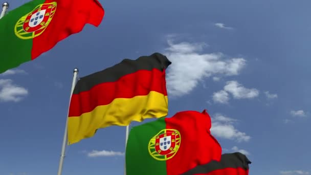 Многие флаги Португалии и Германии, петляющая 3D анимация — стоковое видео