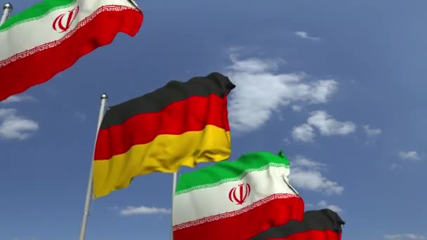 Sventolando bandiere di Iran e Germania su sfondo cielo, animazione 3D loop — Video Stock