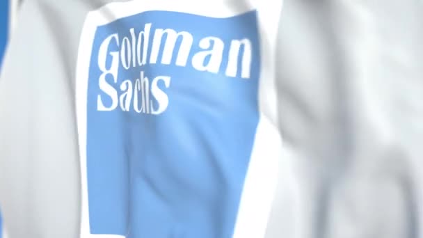 Integetett zászló a Goldman Sachs Group, Inc. emblémájával, közelről. Szerkesztőségi loopable 3D animáció — Stock videók