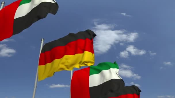 Флаги ОАЭ и Германии на международной встрече, зацикленная 3D анимация — стоковое видео