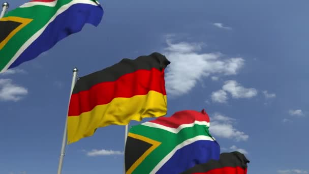 Baris melambaikan bendera Afrika Selatan dan Jerman, animasi 3D yang dapat diulang — Stok Video