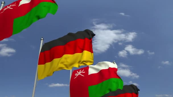 国際会議でオマーンとドイツの旗、ループ可能な3Dアニメーション — ストック動画