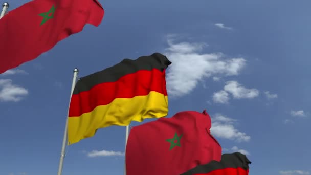 Ondeando banderas de Marruecos y Alemania en el fondo del cielo, animación 3D loopable — Vídeo de stock