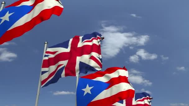 Zwaaiende vlaggen van Puerto Rico en het Verenigd Koninkrijk, loop bare 3D-animatie — Stockvideo