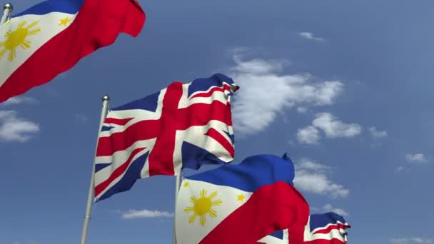 Mávající vlajky Filipín a Velké Británie, smyklihodné 3D animace — Stock video