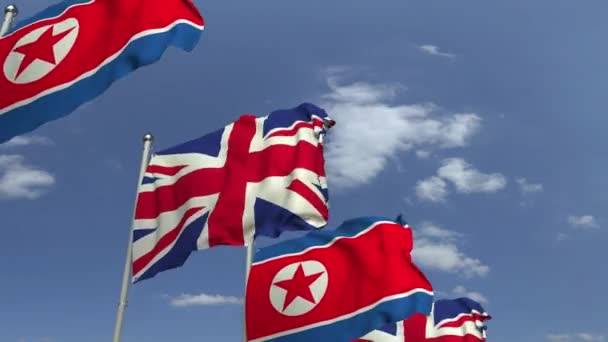 Mávající vlajky Severní Koreje a Spojeného království, smyklihodné 3D animace — Stock video