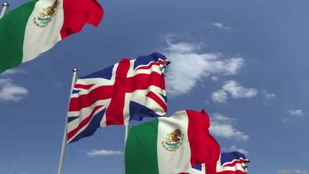 Ondeando banderas de México y el Reino Unido en el fondo del cielo, animación 3D loopable — Vídeo de stock