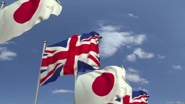 Viele Flaggen Japans und des Vereinigten Königreichs, 3D-Animation — Stockvideo