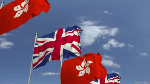 Řada mávající vlajky Hongkongu a Spojeného království, smyklihodné 3D animace — Stock video