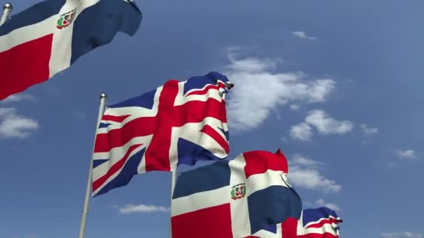 Flags of the Dominican Republic and the United Kingdom at international meeting, loopable 3D animation — Stock Video