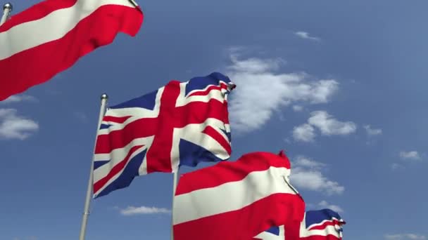 Waving flags of Austria and the United Kingdom on sky background, loopable 3D animation — Stock Video