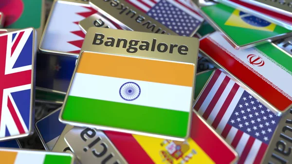 Ímã de lembrança ou crachá com texto Bangalore e bandeira nacional entre diferentes. Viajar para a Índia renderização 3D conceitual — Fotografia de Stock