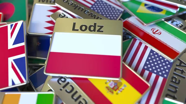Ímã de lembrança ou crachá com texto Lodz e bandeira nacional entre diferentes. Viajando para a Polônia conceitual 3D renderização — Fotografia de Stock