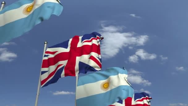 Reihe schwenkender Fahnen Argentiniens und des Vereinigten Königreichs, 3D-Animation — Stockvideo