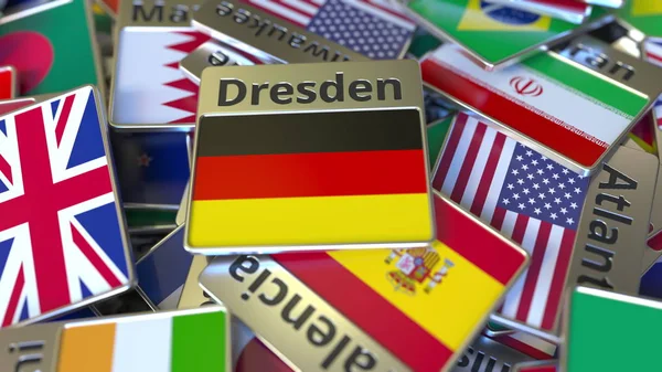 Souvenirmagnet oder Abzeichen mit Dresdener Schriftzug und Nationalflagge unter den verschiedenen. Reisen nach Deutschland konzeptionelles 3D Rendering — Stockfoto