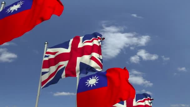 Mavi gökyüzüne karşı Tayvan ve Birleşik Krallık bayrakları, döngülü 3d animasyon — Stok video