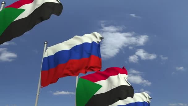 Waving flagi Sudanu i Rosji na tle nieba, zapętlenia animacji 3D — Wideo stockowe