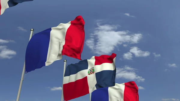 Флаги Доминиканской Республики и Франции на международной встрече, 3D рендеринг — стоковое фото