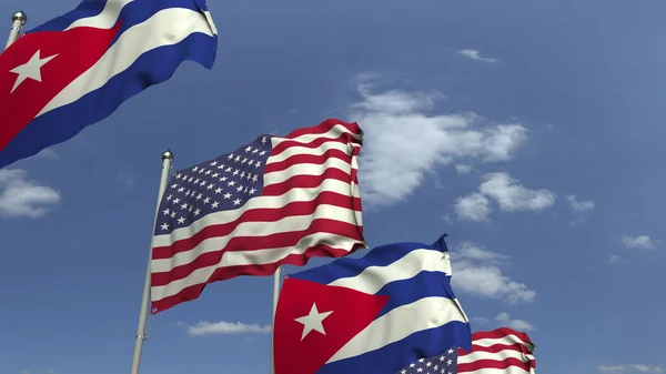 Vlajky Kuby a USA proti modrému nebi, prostorové vykreslování — Stock fotografie