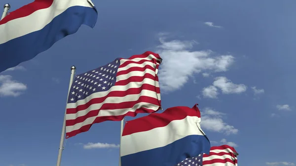 Flags of Netherlands and the USA against blue sky, 3D rendering — Stock Photo, Image